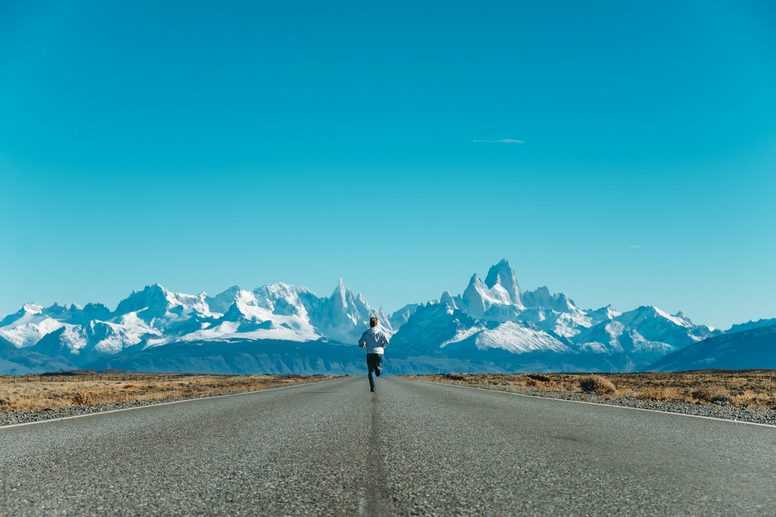 person running on road at daytime