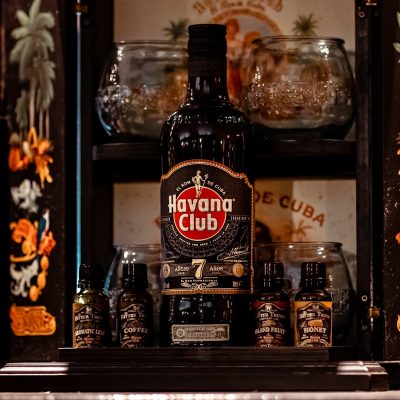 a bottle of alcohol sitting on top of a shelf