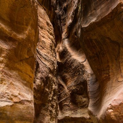 man walking inside the Antelope Canyon during daytime